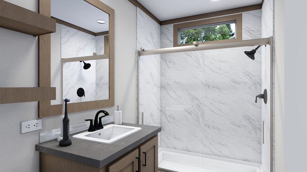 The TRINITY 60 Primary Bathroom. This Manufactured Mobile Home features 2 bedrooms and 2 baths.