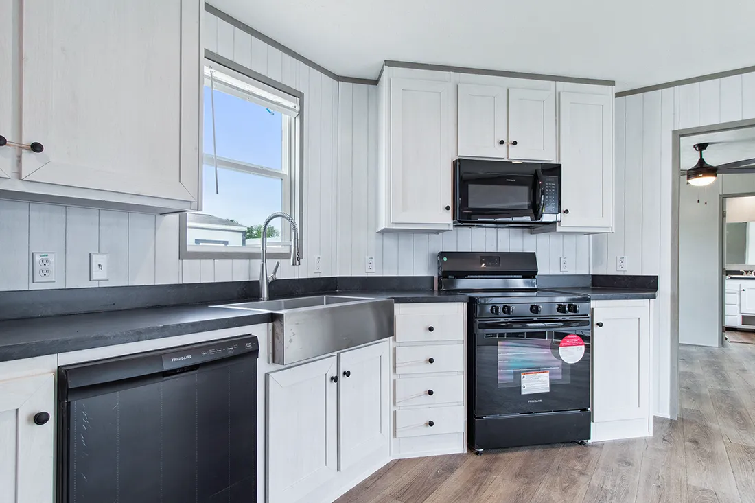 The ANNIVERSARY 16682F Kitchen. This Manufactured Mobile Home features 2 bedrooms and 2 baths.