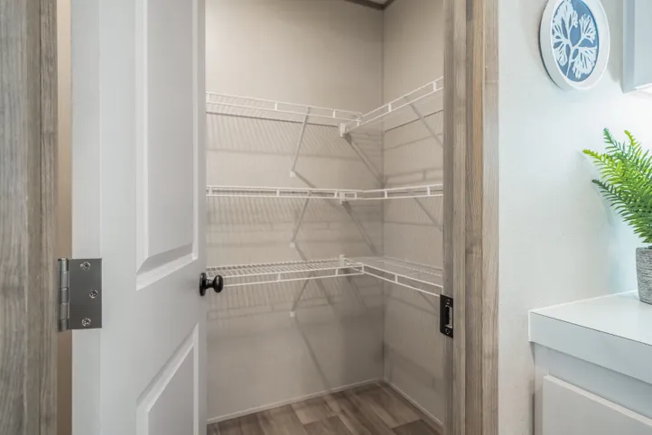 The EL SUENO BREEZE Kitchen. This Manufactured Mobile Home features 4 bedrooms and 2 baths.