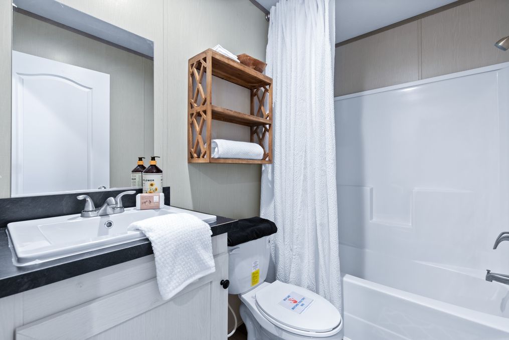 The PORCH LIVING SERIES 16682A Guest Bathroom. This Manufactured Mobile Home features 2 bedrooms and 2 baths.
