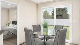 The THE ANNIVERSARY PLUS Dining Room. This Manufactured Mobile Home features 3 bedrooms and 2 baths.