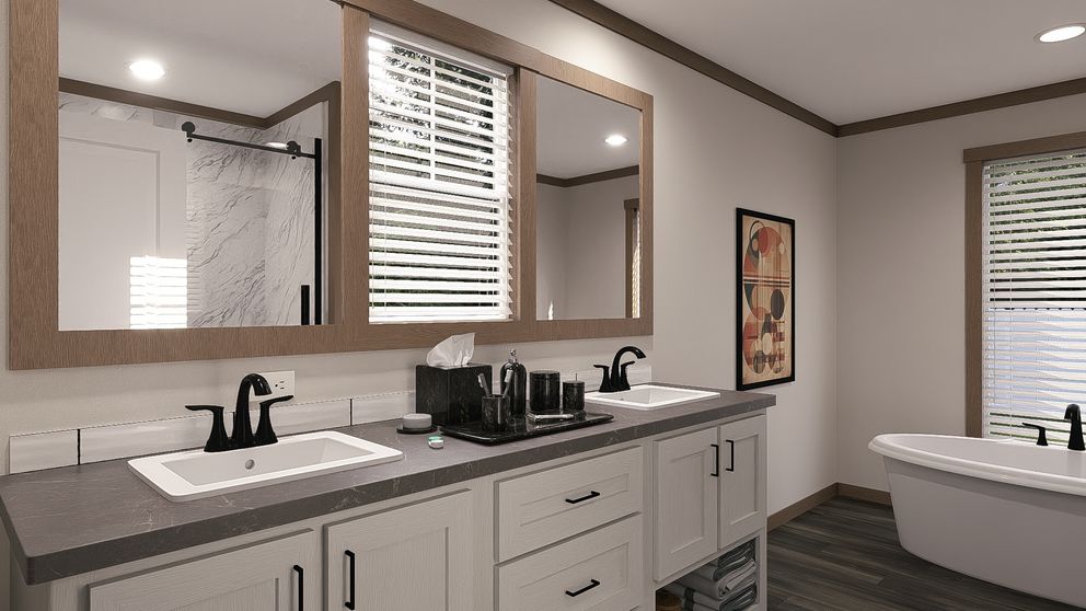 The EVERETT ELITE Primary Bathroom. This Manufactured Mobile Home features 4 bedrooms and 3 baths.