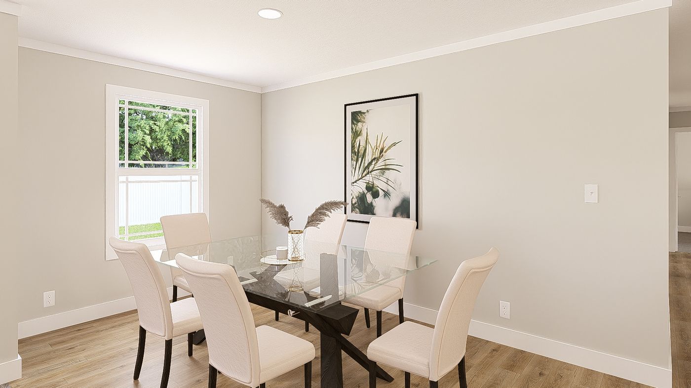 The THE BREEZE 64 Dining Area. This Manufactured Mobile Home features 4 bedrooms and 2 baths.