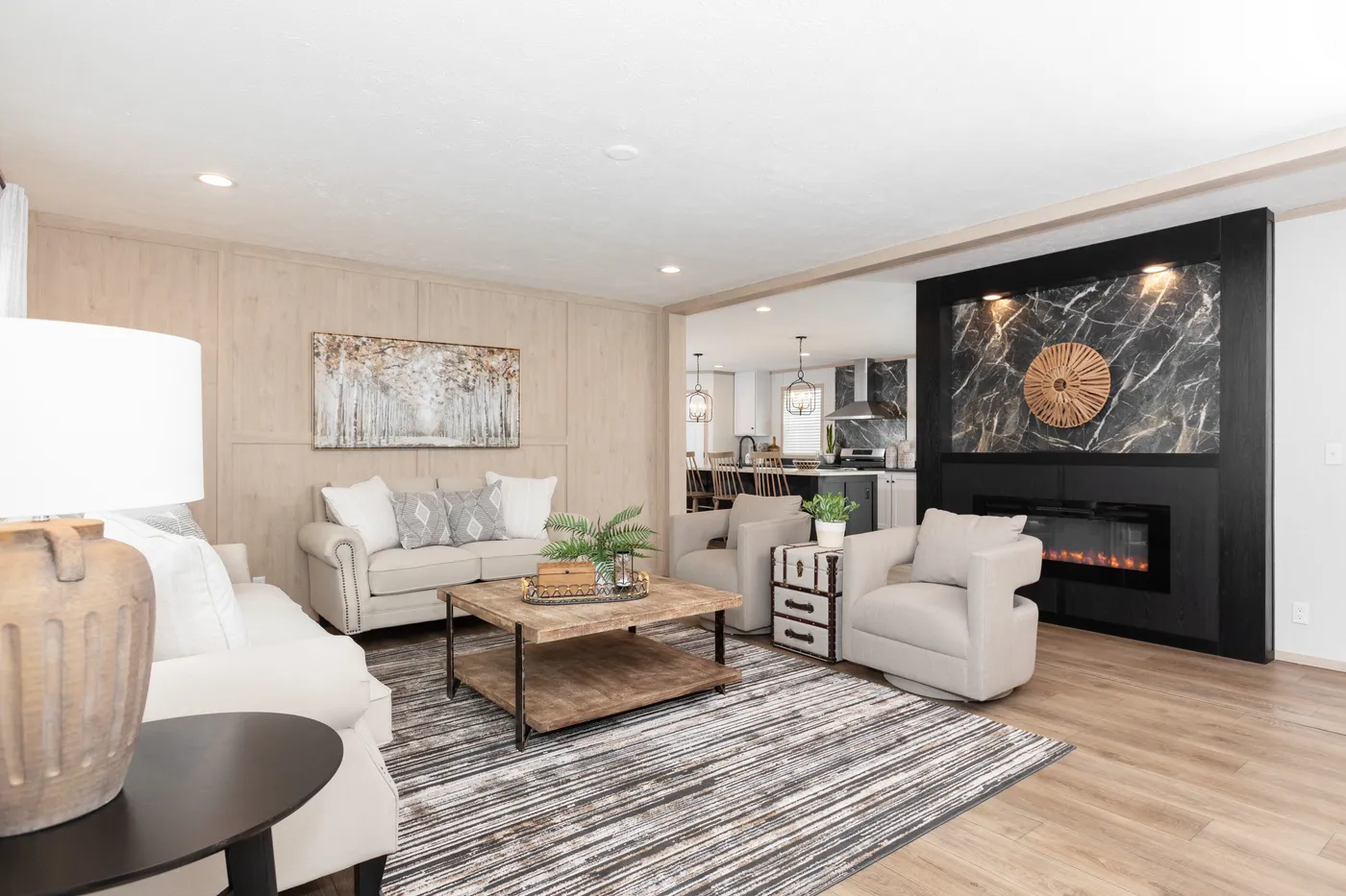 The 6032-5700 THE PULSE Living Room. This Manufactured Mobile Home features 3 bedrooms and 2 baths.