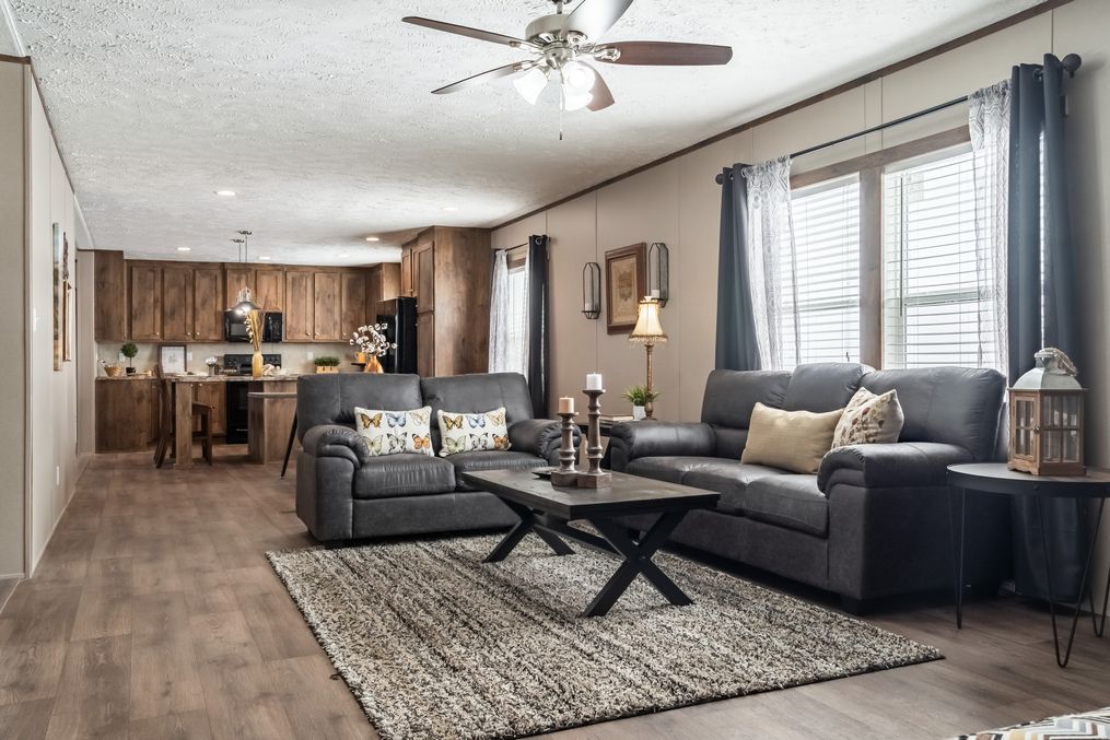 The ULTRA EXCEL 4 BR 28X68 Living Room. This Manufactured Mobile Home features 4 bedrooms and 2 baths.
