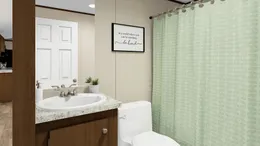 The DELIGHT Guest Bathroom. This Manufactured Mobile Home features 2 bedrooms and 2 baths.