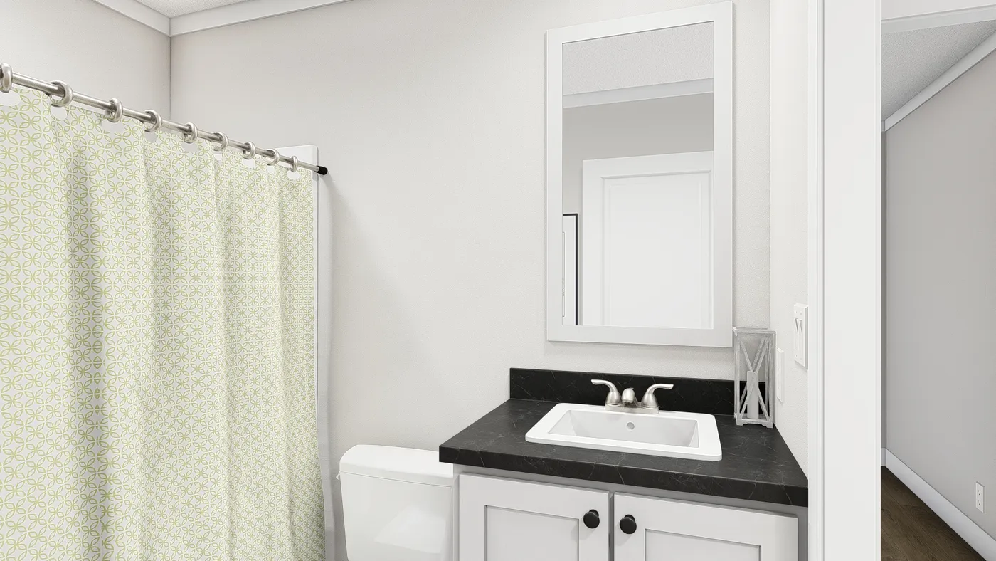 The MOVE ON UP Guest Bathroom. This Manufactured Mobile Home features 3 bedrooms and 2 baths.