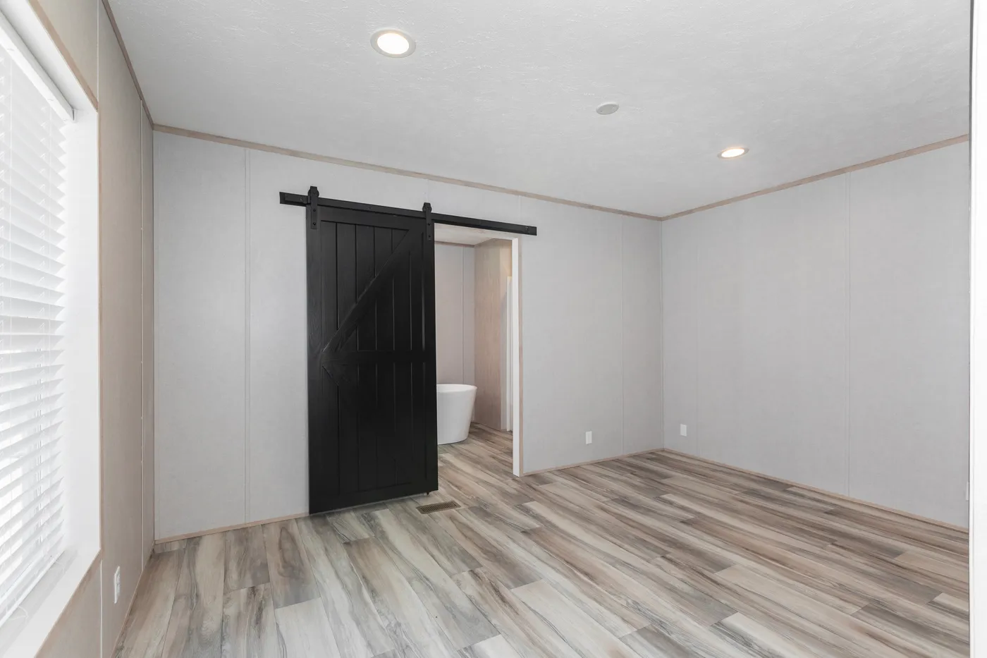The THE THUNDERHEAD Primary Bedroom. This Manufactured Mobile Home features 3 bedrooms and 2 baths.