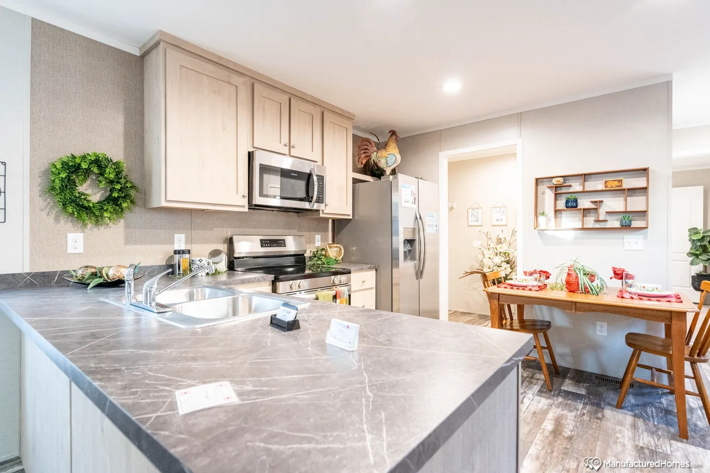 The TOPAZ 70 Kitchen. This Manufactured Mobile Home features 3 bedrooms and 2 baths.