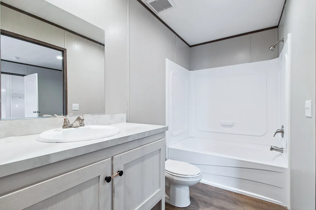 The HOMESTEAD 16562A Primary Bathroom. This Manufactured Mobile Home features 2 bedrooms and 2 baths.