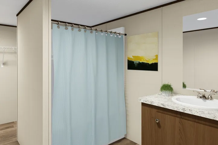 The SATISFACTION Primary Bathroom. This Manufactured Mobile Home features 3 bedrooms and 2 baths.