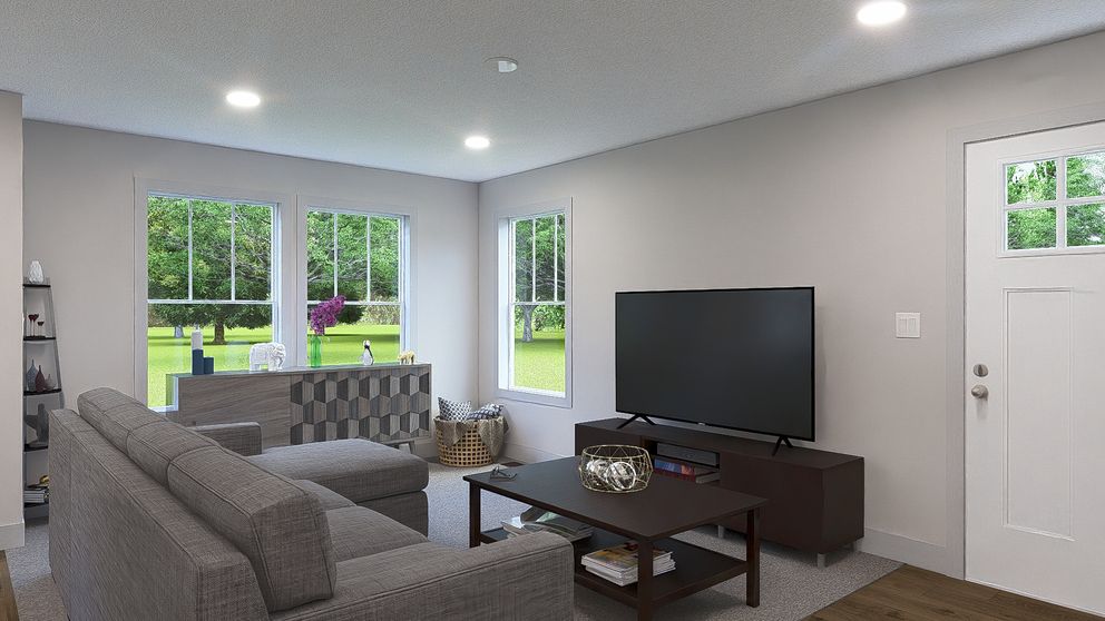 The RISING SUN Living Room. This Manufactured Mobile Home features 2 bedrooms and 2 baths.