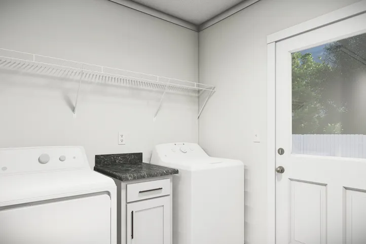 The THE PARKER Utility Room. This Manufactured Mobile Home features 3 bedrooms and 2 baths.