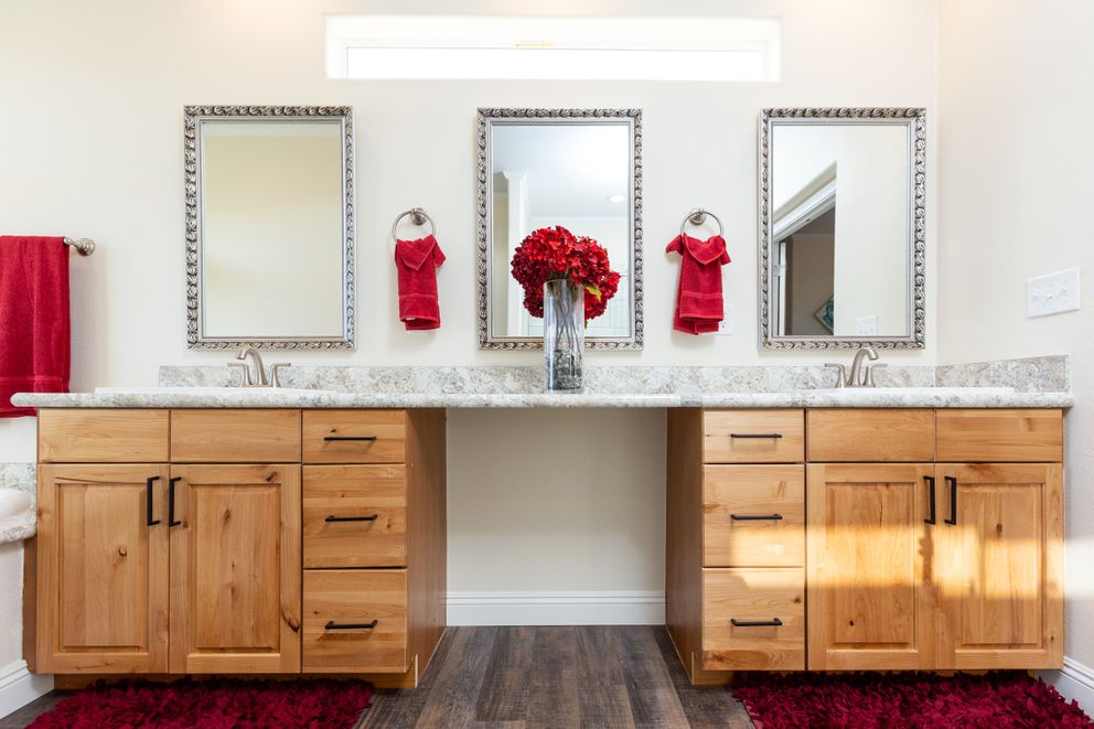 The SUM3076A Primary Bathroom. This Manufactured Mobile Home features 4 bedrooms and 2.5 baths.