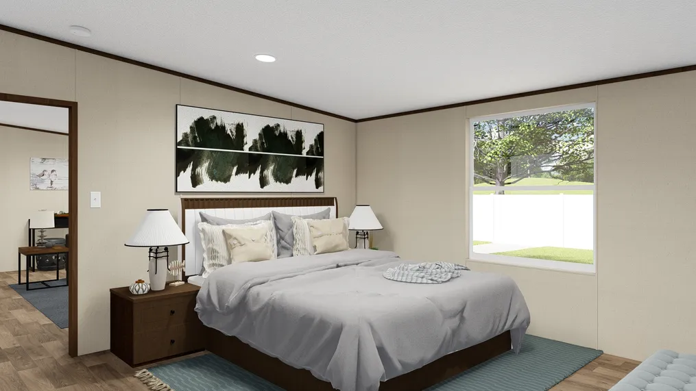 The EXCITEMENT Primary Bedroom. This Manufactured Mobile Home features 3 bedrooms and 2 baths.