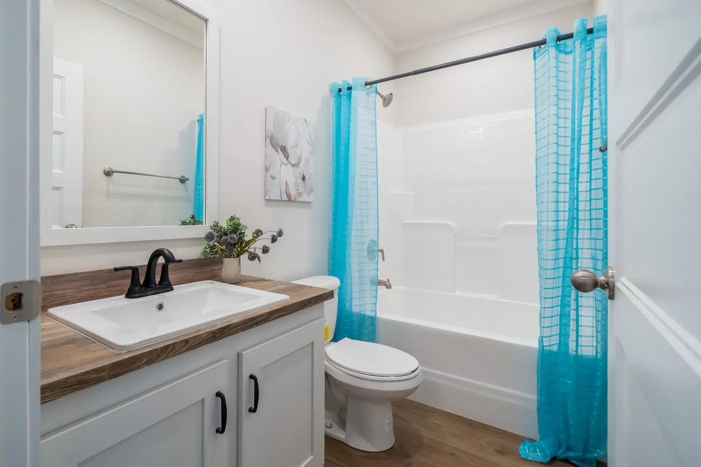 The 3459 MOD 64X28 CAROLINA Guest Bathroom. This Modular Home features 3 bedrooms and 2 baths.