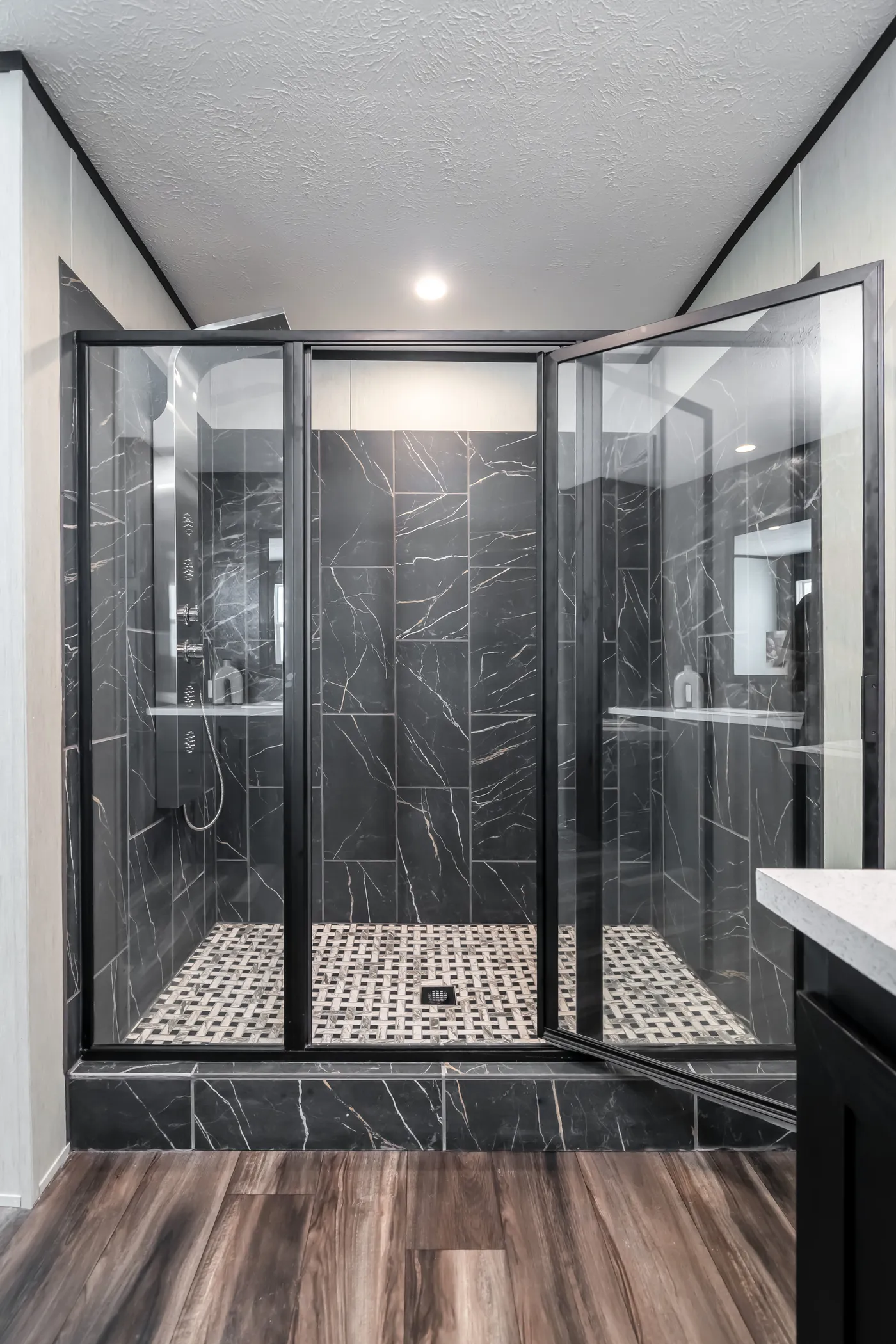 Infinite Black Tile shower with Divinum Calypso tile pan. 