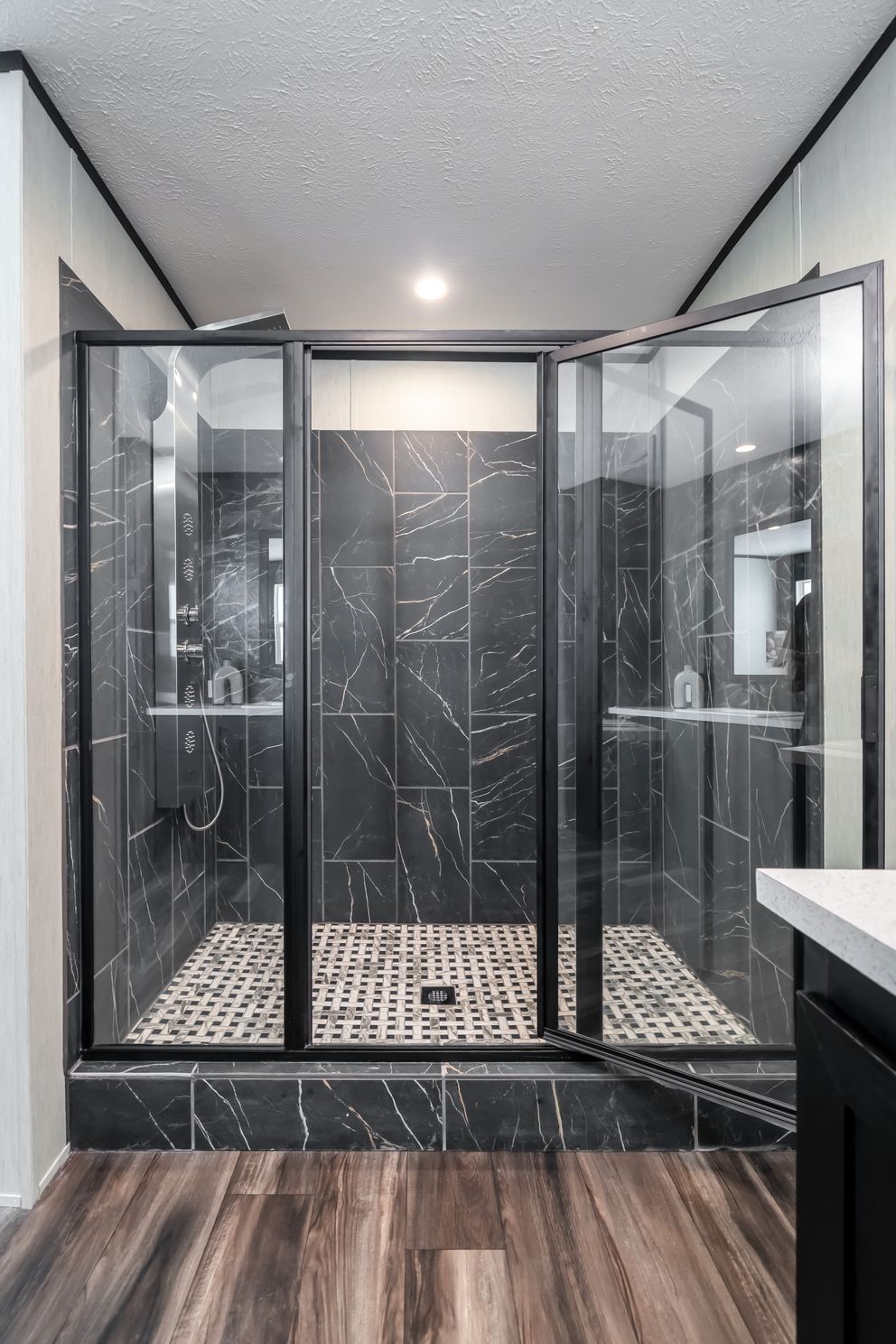 Infinite Black Tile shower with Divinum Calypso tile pan. 