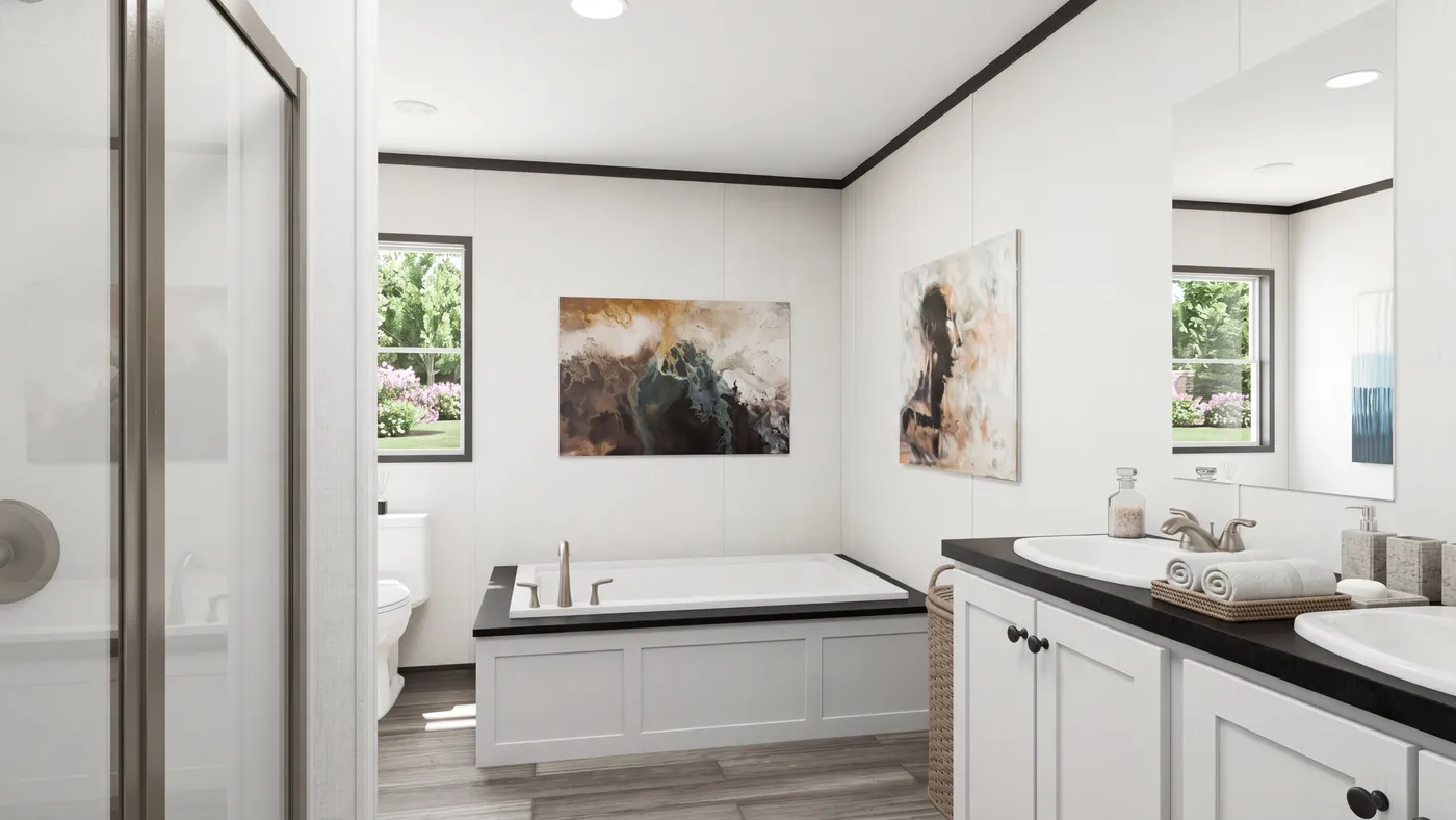 The THE MOUNTAINEER 56 Primary Bathroom. This Manufactured Mobile Home features 3 bedrooms and 2 baths.