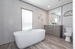 The PLATINUM ANNIVERSARY Primary Bathroom. This Manufactured Mobile Home features 3 bedrooms and 2 baths.