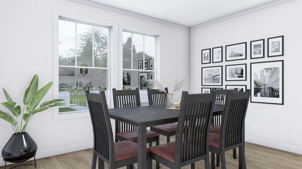 The JOHNNY B GOODE Dining Room. This Manufactured Mobile Home features 3 bedrooms and 2 baths.