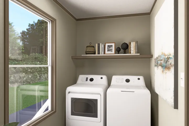 The RAINIER Utility Room. This Manufactured Mobile Home features 4 bedrooms and 3 baths.