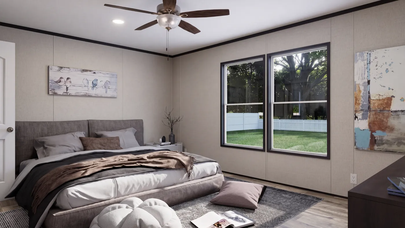 The THE MOUNTAINEER 52 Primary Bedroom. This Manufactured Mobile Home features 3 bedrooms and 2 baths.