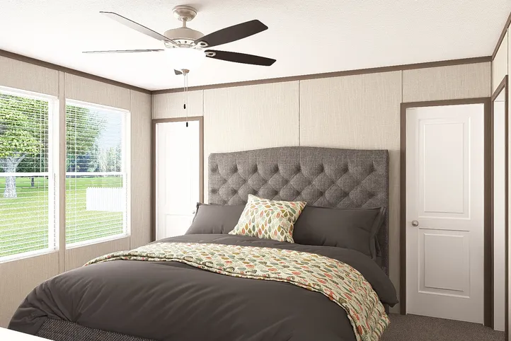 The THE RESERVE 60 Primary Bedroom. This Manufactured Mobile Home features 3 bedrooms and 2 baths.