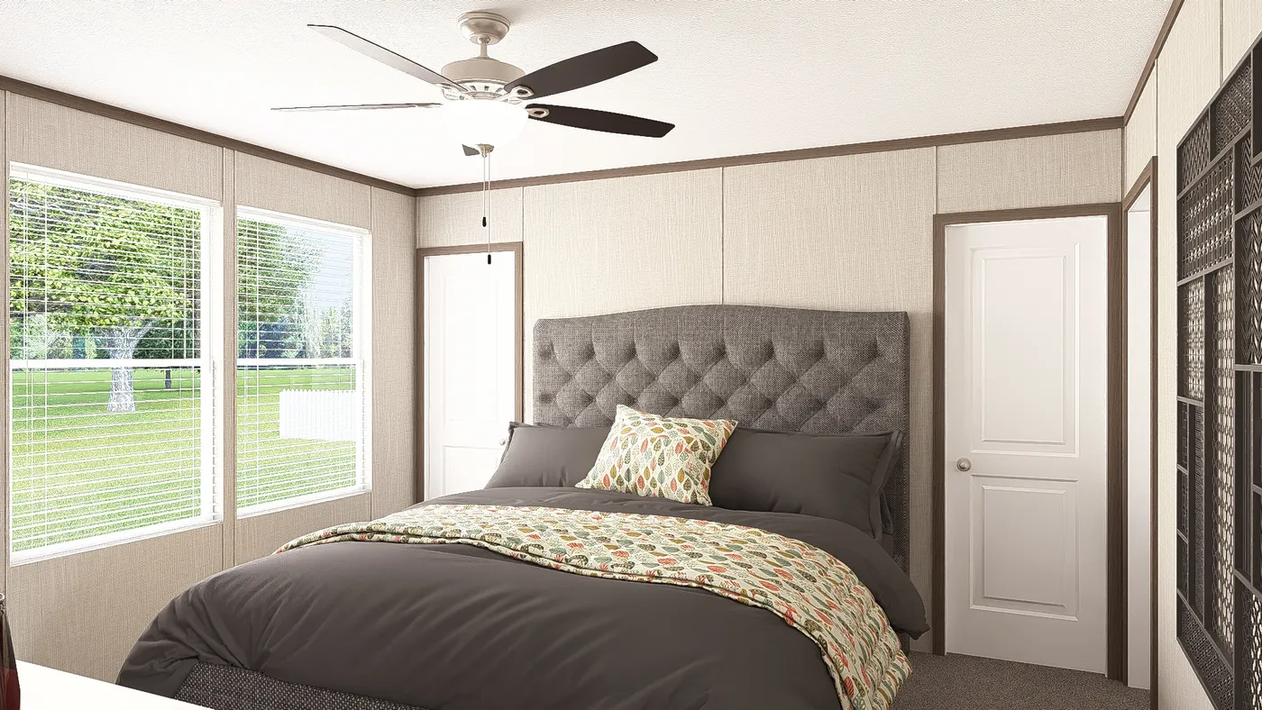 The THE RESERVE 60 Primary Bedroom. This Manufactured Mobile Home features 3 bedrooms and 2 baths.