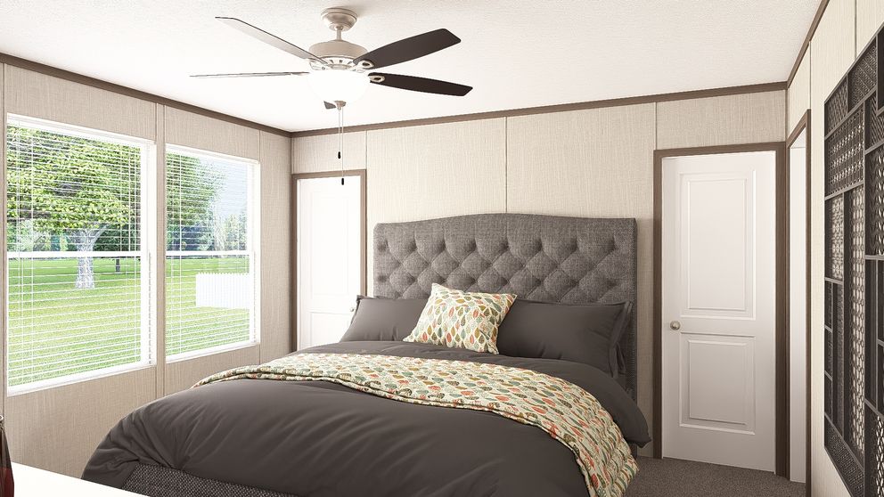 The THE RESERVE 60 Primary Bedroom. This Manufactured Mobile Home features 3 bedrooms and 2 baths.