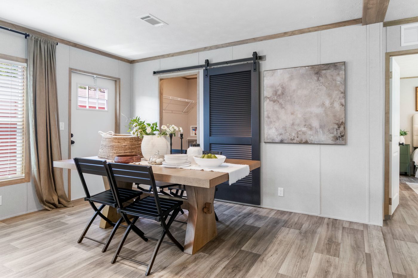 The THE REAL DEAL Dining Area. This Manufactured Mobile Home features 3 bedrooms and 2 baths.