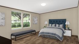 The THRILL Primary Bedroom. This Manufactured Mobile Home features 3 bedrooms and 2 baths.