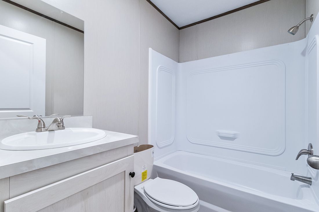 The SELECT 16723A Guest Bathroom. This Manufactured Mobile Home features 3 bedrooms and 2 baths.
