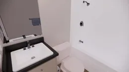 The 7616-4200 ADRENALINE Guest Bathroom. This Manufactured Mobile Home features 3 bedrooms and 2 baths.
