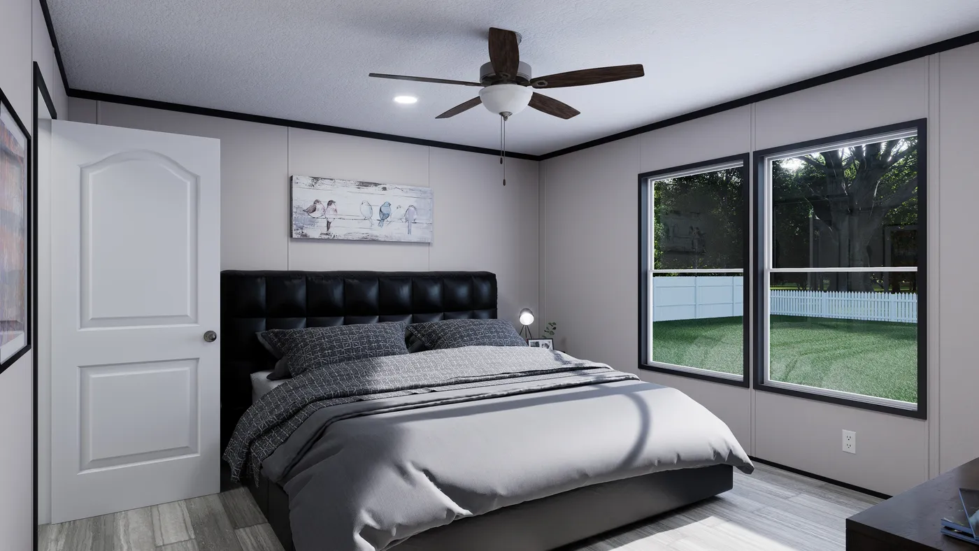 The THE MOUNTAINEER 56 Primary Bedroom. This Manufactured Mobile Home features 3 bedrooms and 2 baths.