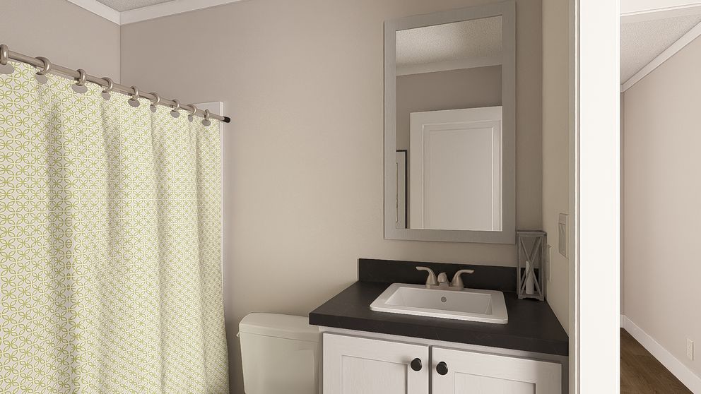 The MOVE ON UP Guest Bathroom. This Manufactured Mobile Home features 3 bedrooms and 2 baths.