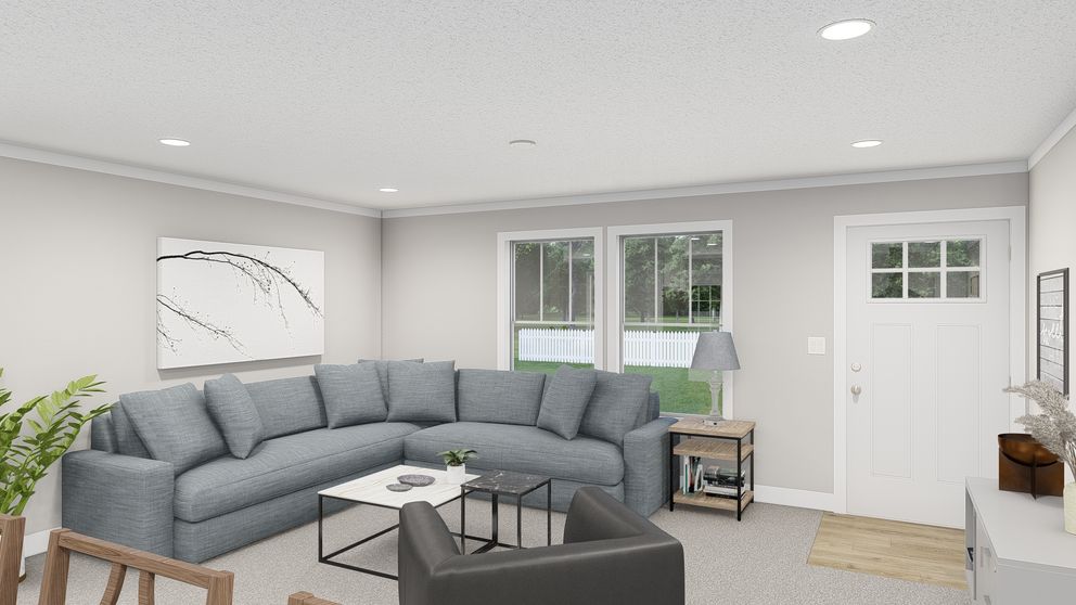 The BROWN EYED GIRL Living Room. This Manufactured Mobile Home features 4 bedrooms and 2 baths.