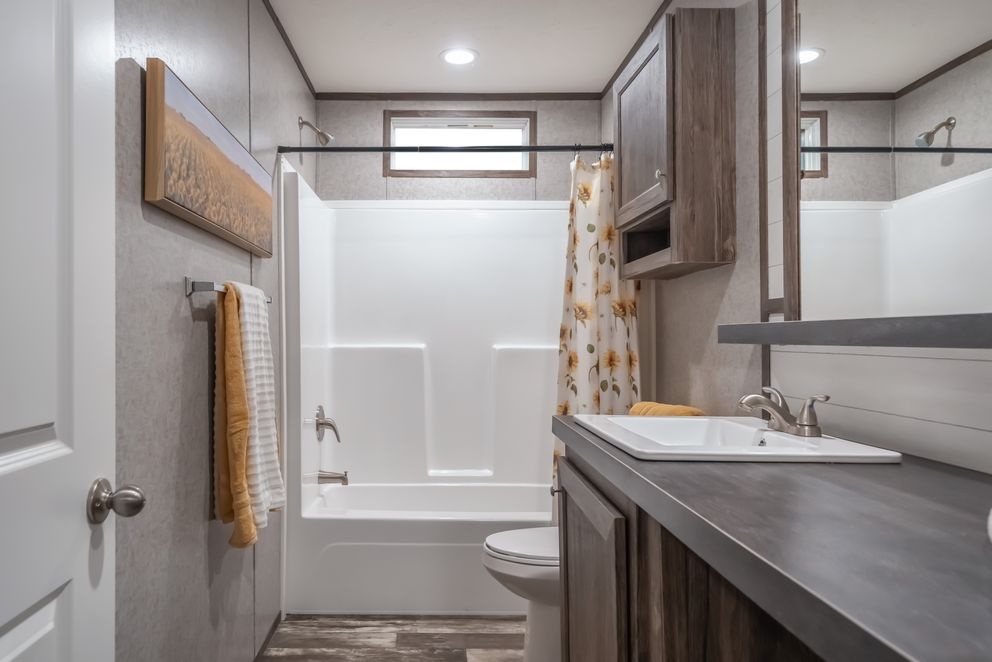 The LOCKLEAR Exterior. This Manufactured Mobile Home features 4 bedrooms and 2 baths.