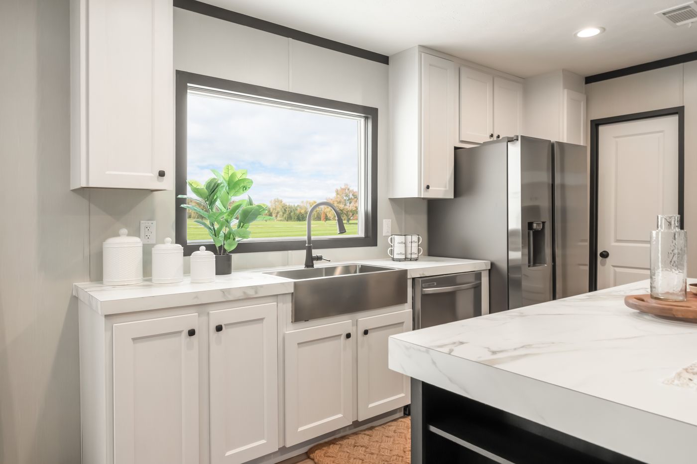 The THE ANNIVERSARY 2.1 Kitchen. This Manufactured Mobile Home features 3 bedrooms and 2 baths.