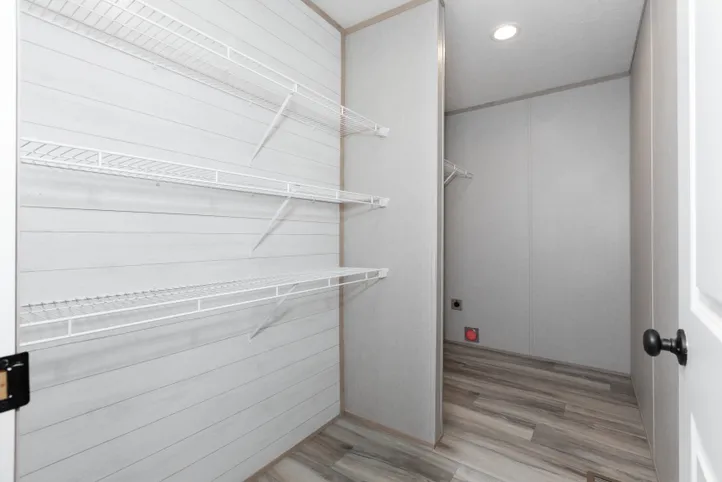 The THE ANNIVERSARY ISLANDER Utility Room. This Manufactured Mobile Home features 3 bedrooms and 2 baths.