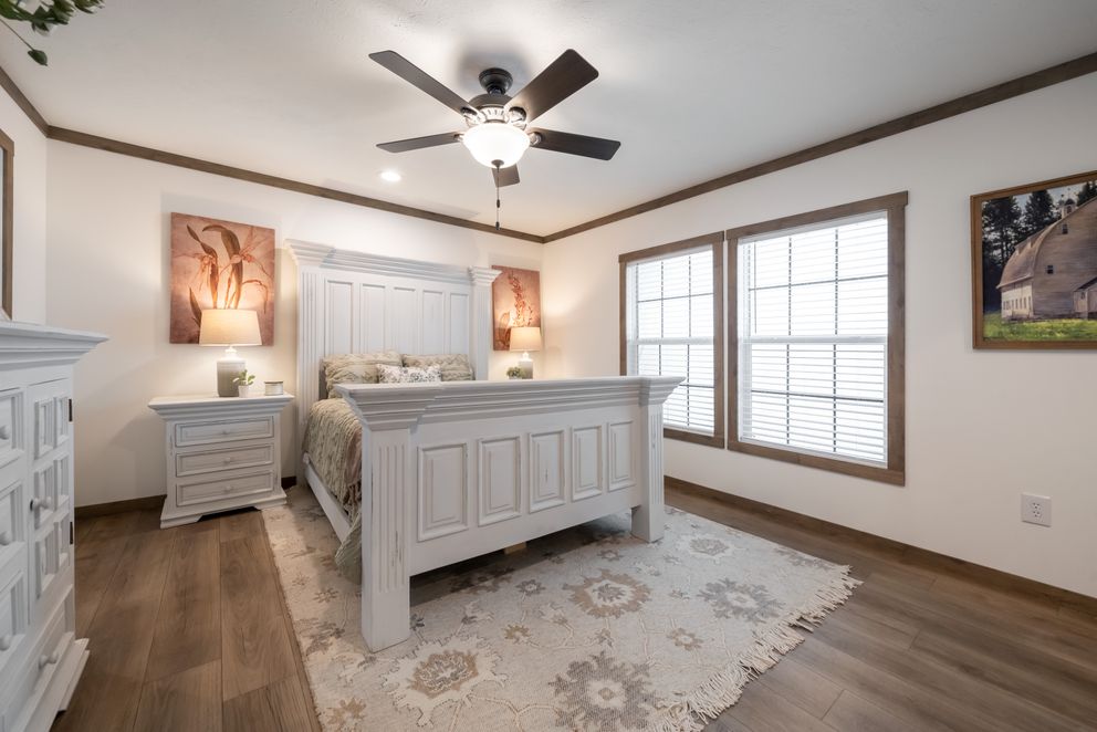 The THE LIZZIE Primary Bedroom. This Manufactured Mobile Home features 3 bedrooms and 2 baths.