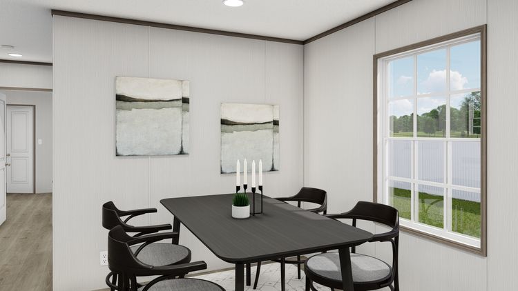 The LEGEND ANNIVERSARY 16X76 Dining Area. This Manufactured Mobile Home features 3 bedrooms and 2 baths.