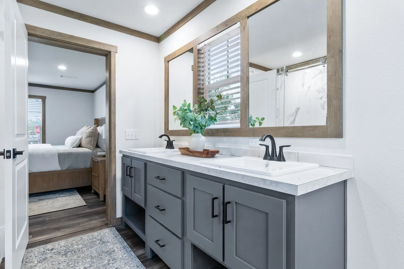 The EVERETT ELITE Primary Bathroom. This Manufactured Mobile Home features 4 bedrooms and 3 baths.