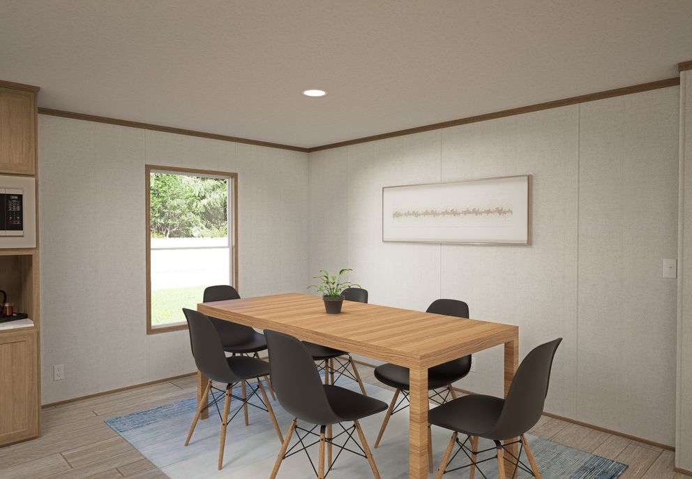 The THE MOUNTAINEER 68 Dining Area. This Manufactured Mobile Home features 4 bedrooms and 2 baths.