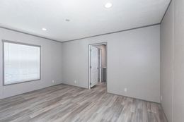 The BLAZER 76 P Primary Bedroom. This Manufactured Mobile Home features 3 bedrooms and 2 baths.