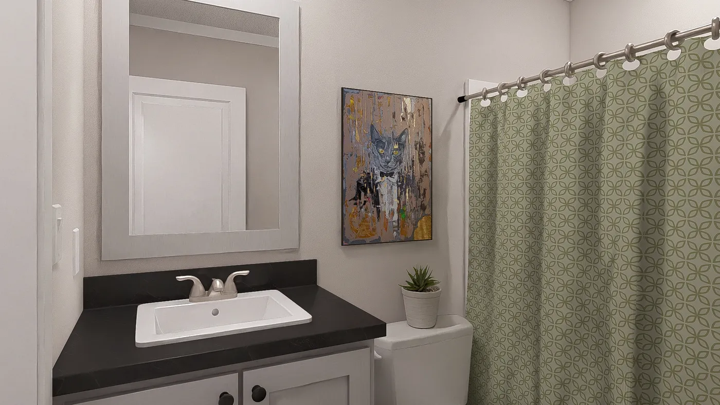 The BORN TO RUN Guest Bathroom. This Manufactured Mobile Home features 2 bedrooms and 2 baths.