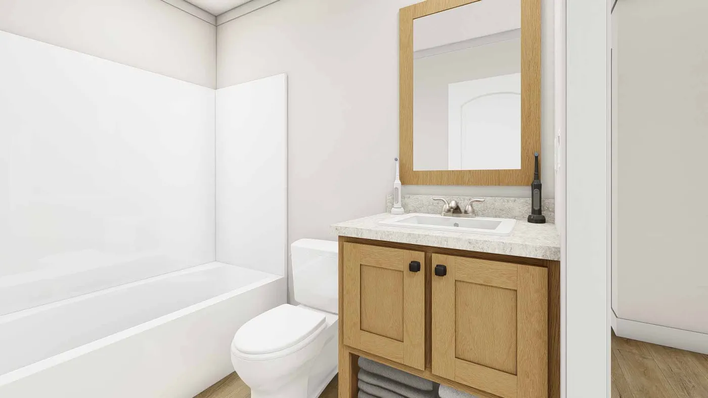 The RHYTHM NATION Guest Bathroom. This Manufactured Mobile Home features 3 bedrooms and 2 baths.