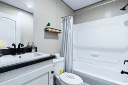 The ANNIVERSARY 16763A Guest Bathroom. This Manufactured Mobile Home features 3 bedrooms and 2 baths.
