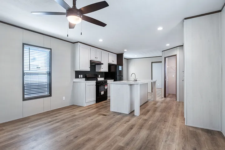 The SELECT 16723B Living Room. This Manufactured Mobile Home features 3 bedrooms and 2 baths.