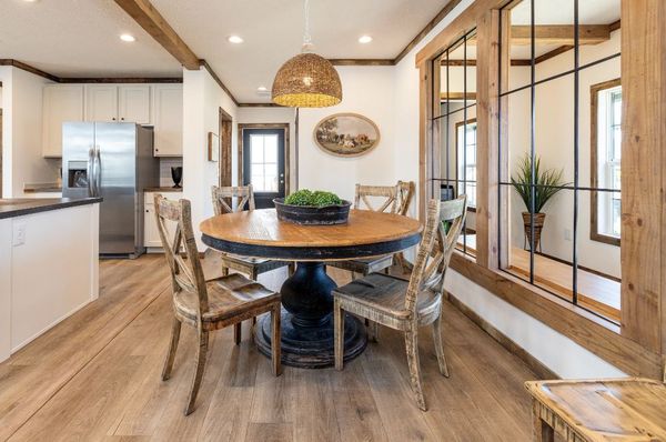 The ARABELLA Dining Room. This Manufactured Mobile Home features 3 bedrooms and 2 baths.